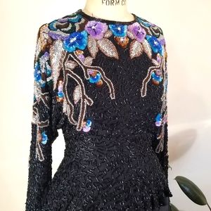 Heavily beaded peplum top